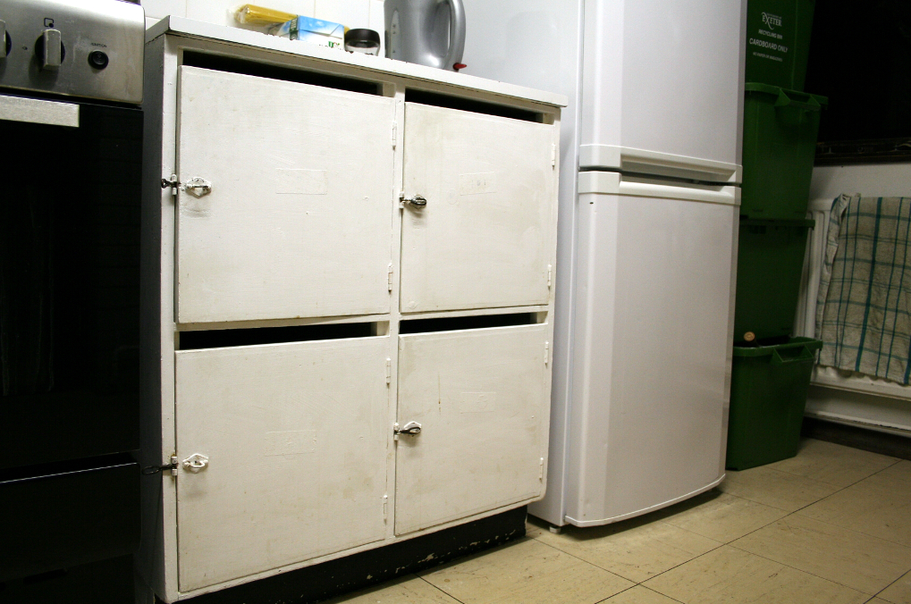 The food cupboards and recycling boxes.