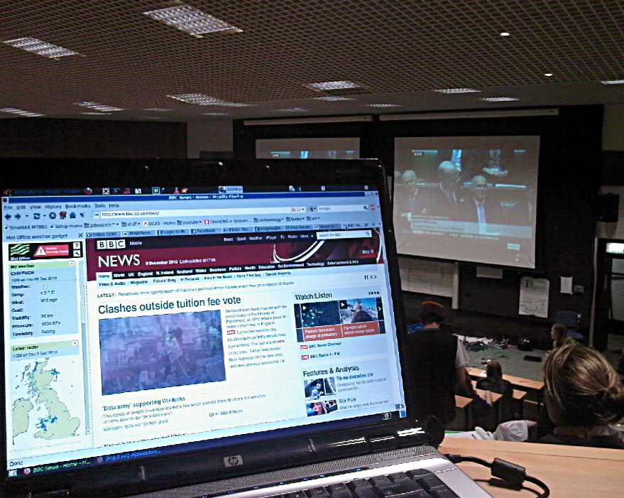 An online BBC News article, with BBC News showing on the presentation screens behind.